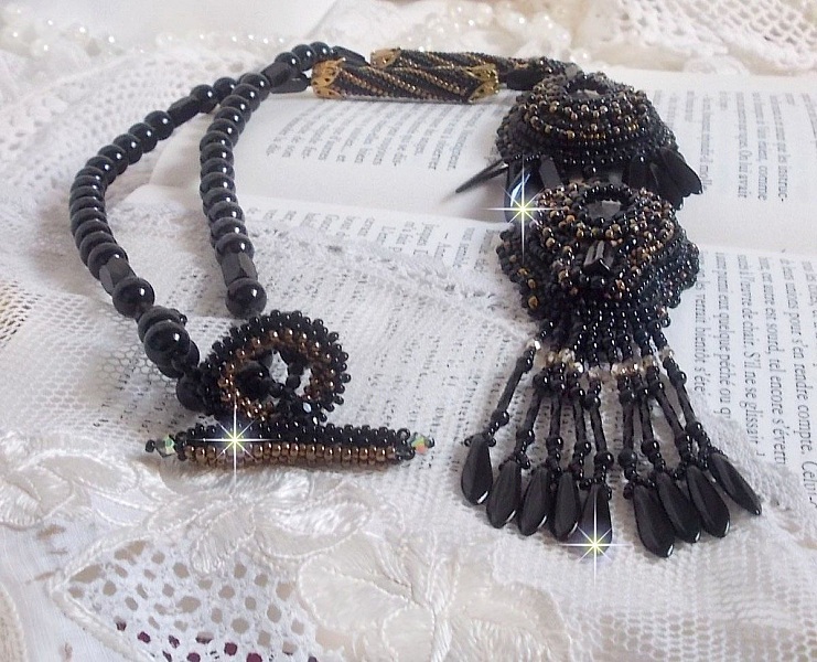 Black Habit Pendant embroidered with round Onyx stones, faceted pendants, faceted cylinder beads, facets and quality seed beads