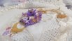 Laureline pendant necklace embroidered with purple DMC cotton, Swarovski crystals and frosted flowers.
