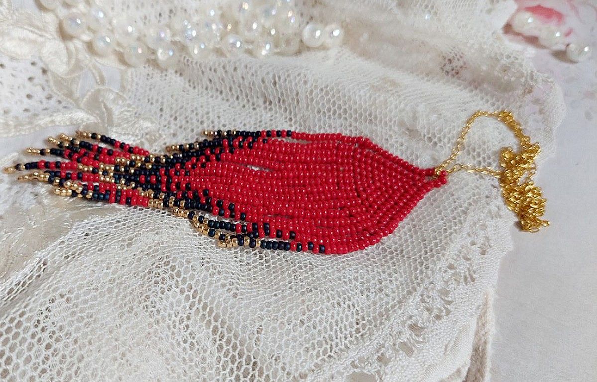 Red Swirls Pendant created with quality seed beads and a gold-plated chain