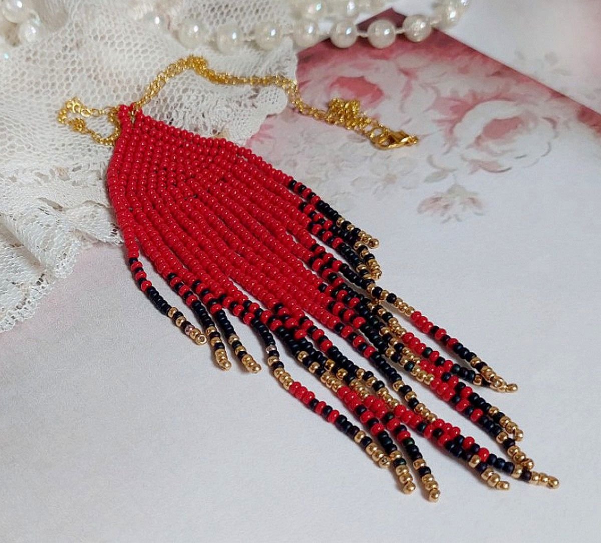 Red Swirls Pendant created with quality seed beads and a gold-plated chain