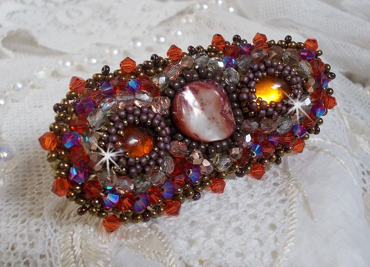 Topaz hair clip embroidered with a mahogany mother-of-pearl cabochon, Swarovski crystals and seed beads