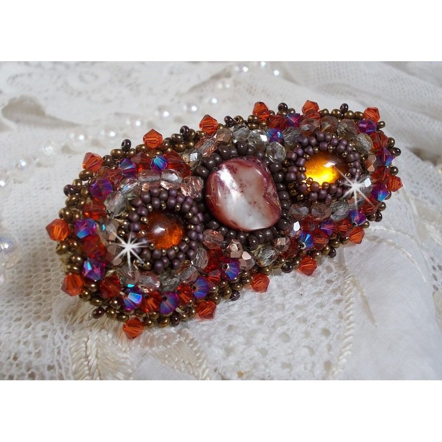 Topaz hair clip embroidered with a mahogany mother-of-pearl cabochon, Swarovski crystals and seed beads