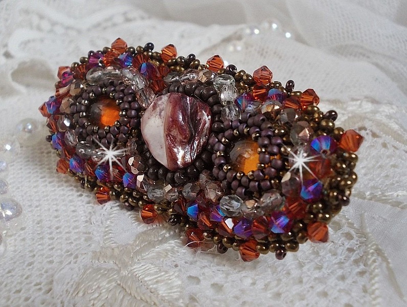 Topaz hair clip embroidered with a mahogany mother-of-pearl cabochon, Swarovski crystals and seed beads