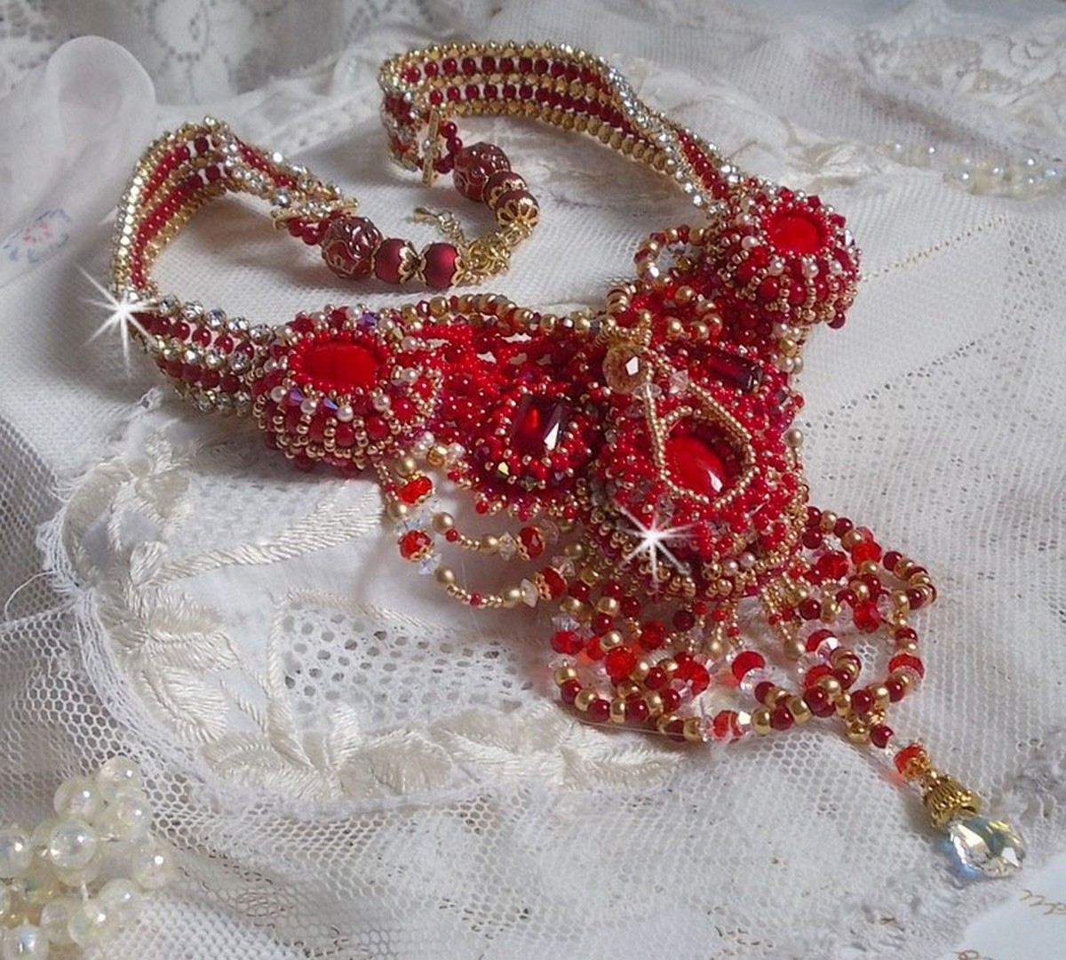 Ruby necklace embroidered with red agate and semi-precious coral beads Haute-Couture style