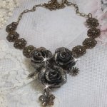 Steampunk Queen necklace created with black and brown porcelain roses, crystal cabochons and bronze accessories