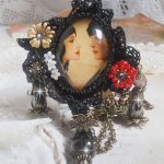 Love Romance necklace created with crystals, an oval cabochon representing two women, Quartz, Hematite, gold plated beads and other accessories