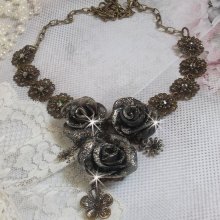 Steampunk Queen necklace created with black and brown porcelain roses, crystal cabochons and bronze accessories