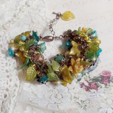 Bracelet Cézanne créé avec des grandes et petites fleurs peintes à la main dans les tons de Jaune, Or, Vert, Bleu, Cuivre, Marron et Bronze à laquelle s’ajoute perles : Aventurine et Jade Jaune Clair