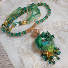 Green Iris necklace embroidered with emerald green DMC cotton, Swarovski crystals, resin beads and seed beads