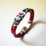 Florâme bracelet with cherry fruit ribbon on red leather