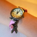 Pink leather girl's watch with adjustable bracelet charm