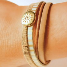 Multi-link leather cuff bracelet with gold sunburst loop