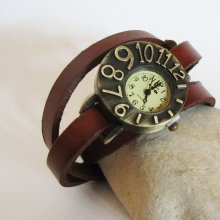 Watch with leather strap and asymmetrical dial