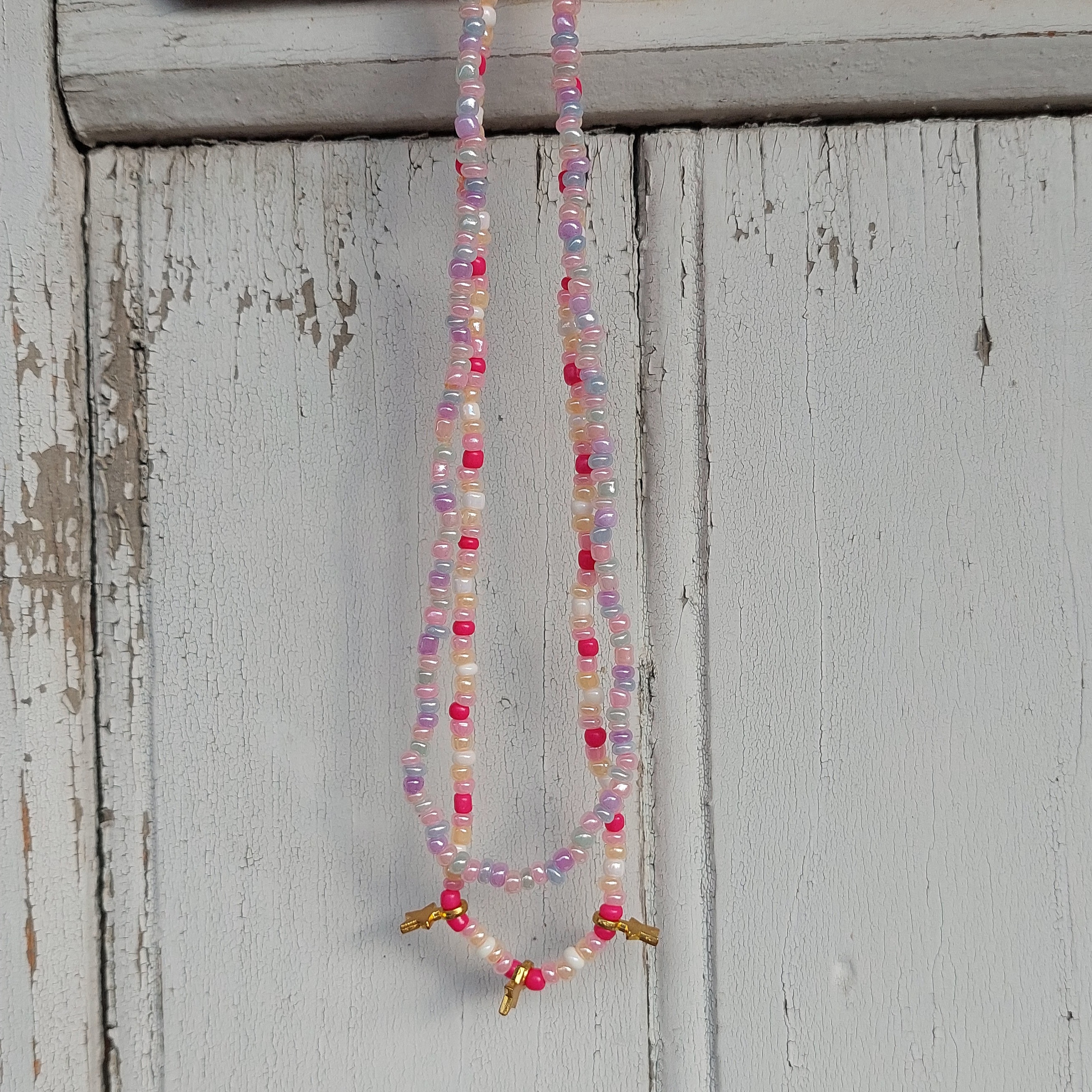 Ras du cou flaschi rose et &eacute;toiles dor&eacute;es