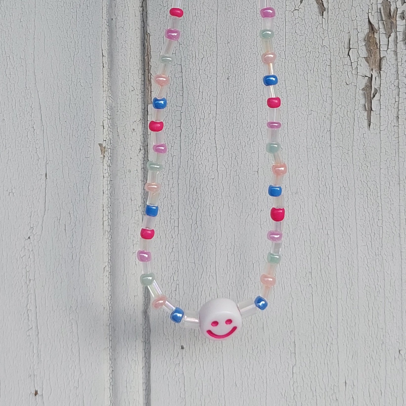 Ras du cou Smiley couleur pastel