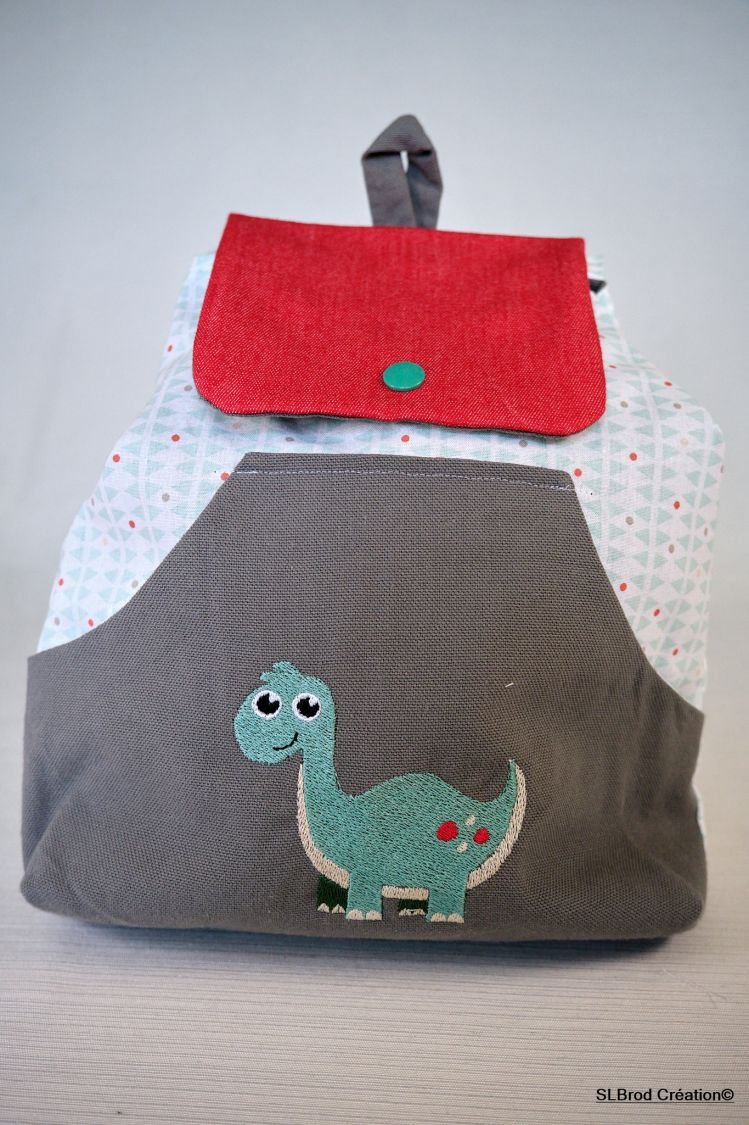 Embroidered dinosaur backpack to personalize