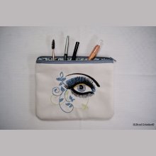 Flat case embroidered with arabesque eye